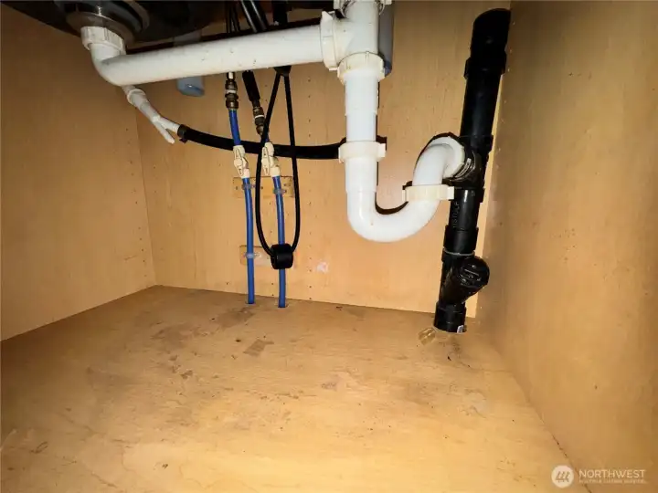 Under hallway bathroom sink.