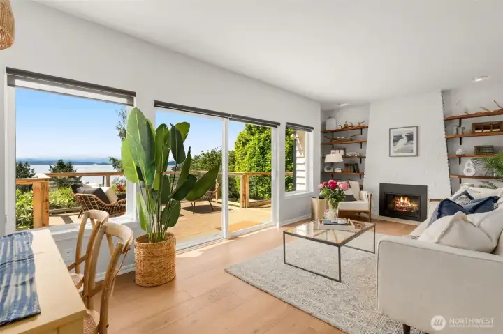 Open floor plan on main level with new hardwood floors, gas fireplace and custom built shelving. Open floor plan on main level with new hardwood floors, gas fireplace and custom built shelving.