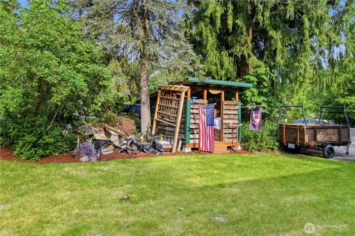 Firewood shed in front yard