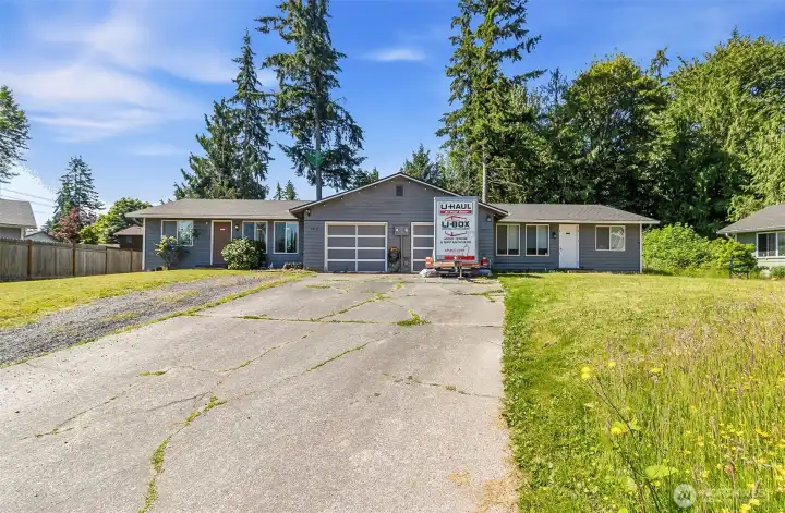 Ample Parking for Multiple Vehicles~Garage Doors equipped with Remote Control Openers
