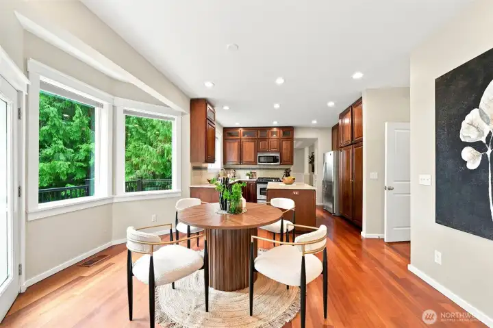 The dining area opens to spacious composite deck.