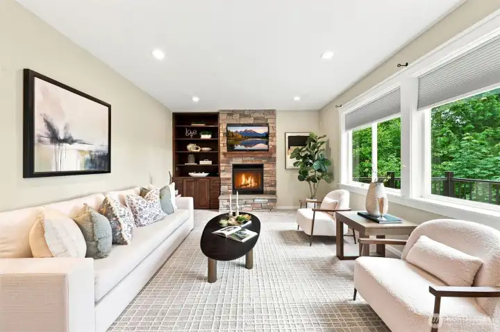 The family room has a gas fireplace and the TV mounted above the mantle stays with the home.