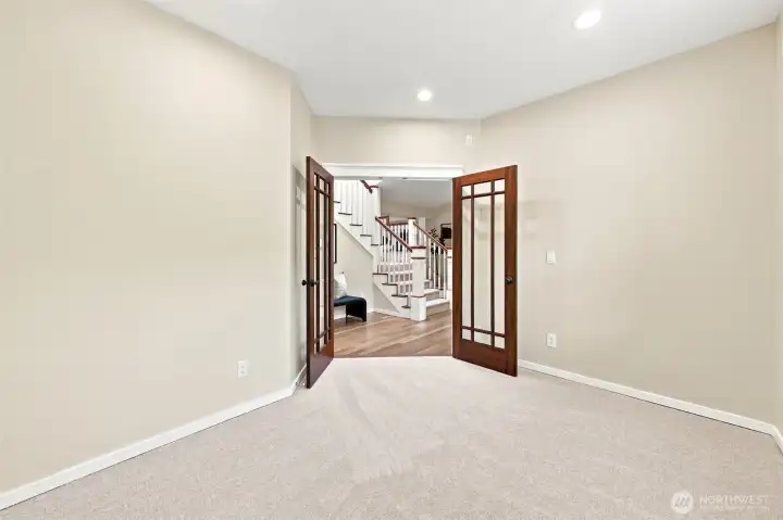 French doors lead into the main floor den.
