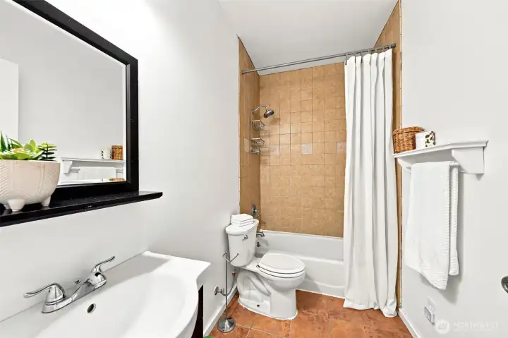 Full bathroom downstairs, adjacent to bedroom.