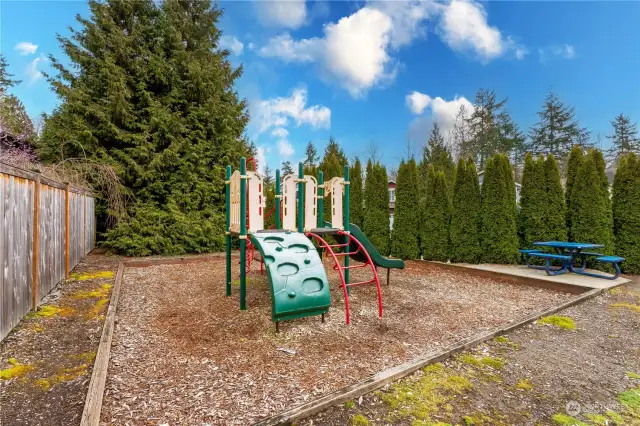 Playground around the corner from the sport court, as shown in aerial view photo