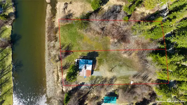 Aerial view of cabin & 2nd parcel. Red lines are an approximate of lot sizes. 2nd lot is potentially buildable. Buyer to verify.