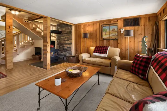 A view from the living room. You can enjoy the warm fire place on winter days. The hand cut cedar tongue & grove complete the cozy cabin feeling.