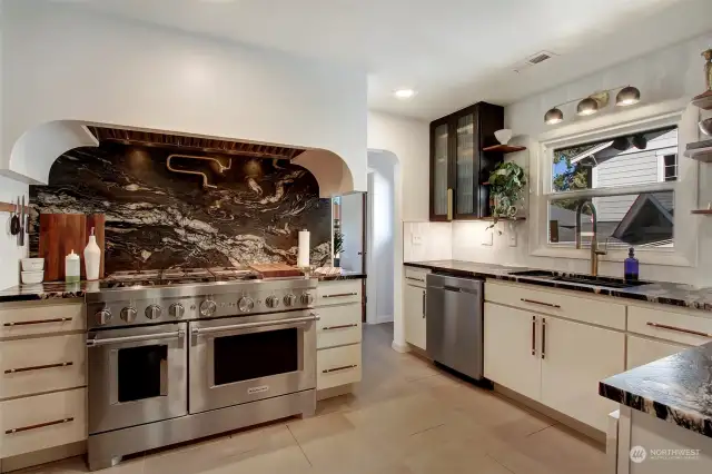 True cook's kitchen - 48" range and double oven, granite counters, custom tile work