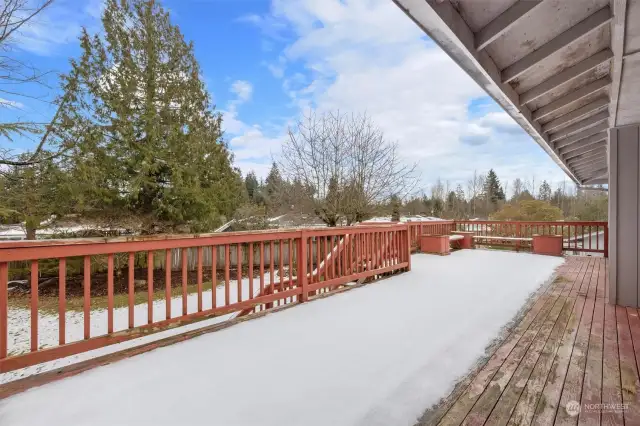 Expansive Back Deck with Stairs to Backyard