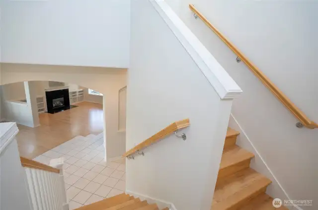 Midway up the staircase, enjoy a stunning overlook of the spacious living area below.