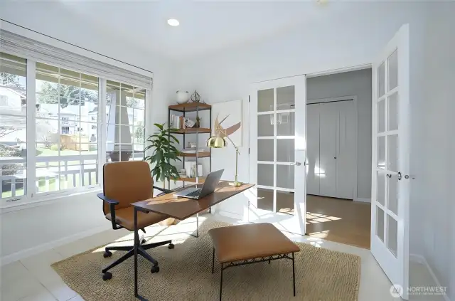 As you step inside, French doors welcome you into the main-level office/den, bathed in abundant natural light - virtually staged.