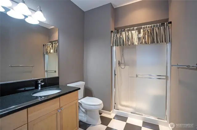 Well-placed lower-level guest bath, perfect for accommodating guests enjoying entertainment and activities.