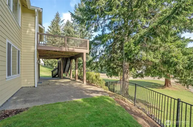Enjoy hosting on the lower-level patio, offering stunning views of the golf course.