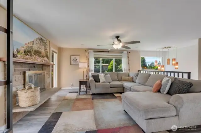 Comfortable family room with fire place and lots of windows!