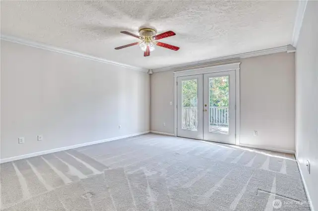 Primary Bedroom with French doors to back deck