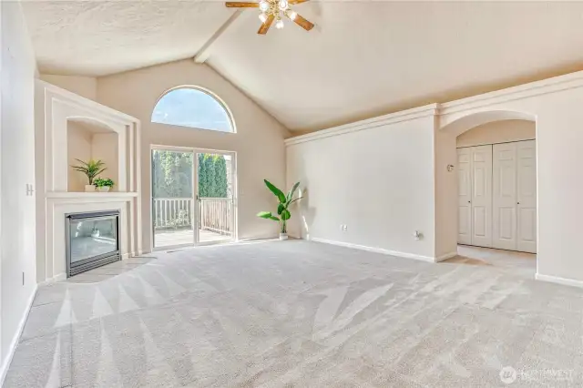 Back Living room with propane fireplace and lofted ceilings