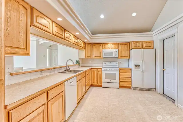 Large open kitchen with garage door access.