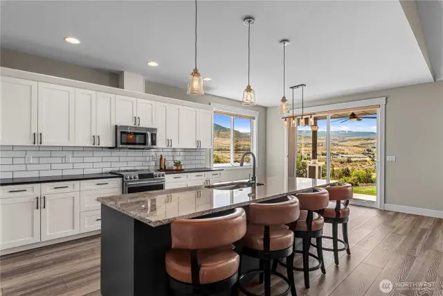 Luxurious spacious kitchen with large island, double oven, high end appliances and walk in pantry