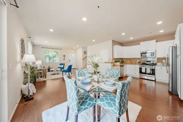 This space will easily fit a much larger dining table but still looks cozy and warm with a 4 piece setting.
