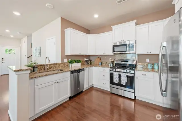 No shortage of cabinet and counter space with this kitchen.