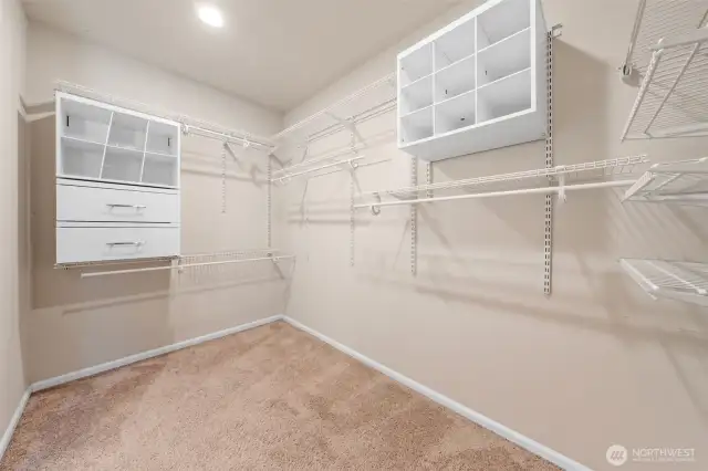 Extra large primary closet with built in storage is a dream.