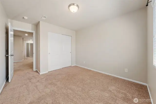 Guest Bedroom #1 with double door closet.