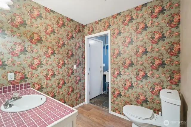 Main Floor powder room, door leads into the laundry room.
