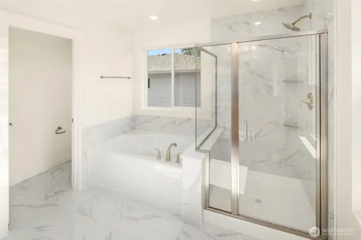 The beautifully finished 5 piece master bathroom
