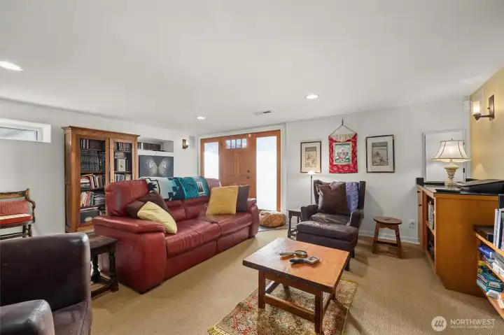 Media room with separate door to the outside. Would you use this for watching the fall games, or develop it into an ADU for income to buy tickets to go to games in person?