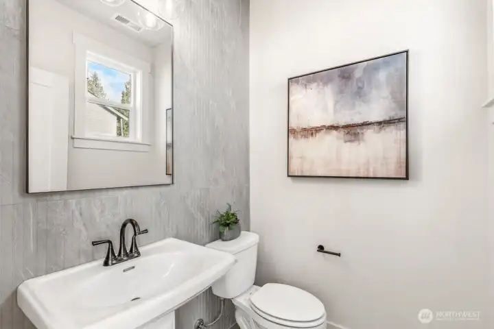Powder room on main floor. Interior photos are of the Sheridan model home at Maywood Heights. Same floor plan but colors and finishes will vary. Photos are for illustration purposes only.
