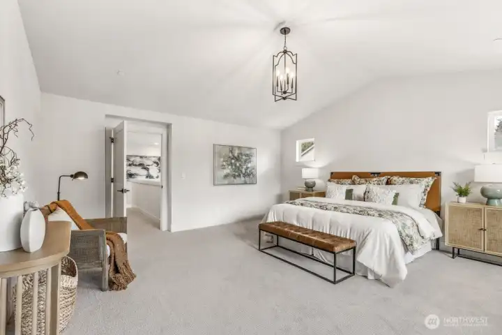 Gorgeous primary second story bedroom with vaulted ceilings. Interior photos are of the Sheridan model home at Maywood Heights. Same floor plan but colors and finishes will vary. Photos are for illustration purposes only.