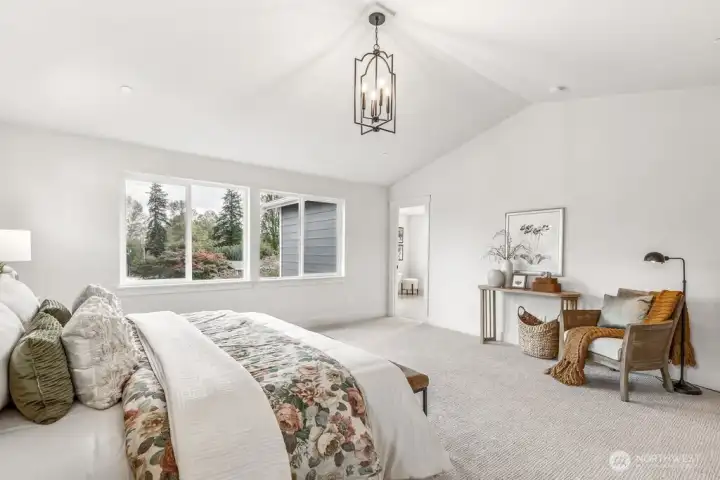 Gorgeous primary second story bedroom with vaulted ceilings. Interior photos are of the Sheridan model home at Maywood Heights. Same floor plan but colors and finishes will vary. Photos are for illustration purposes only.