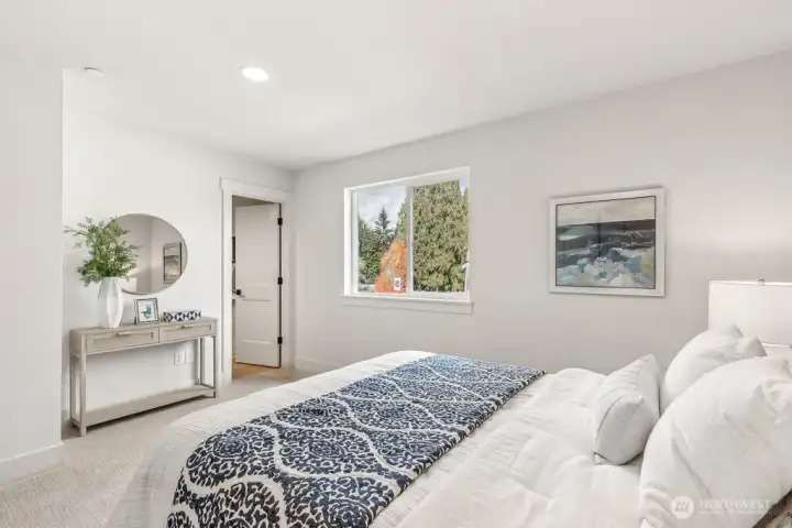 Second story bedroom with ensuite-bath. Interior photos are of the Sheridan model home at Maywood Heights. Same floor plan but colors and finishes will vary. Photos are for illustration purposes only.