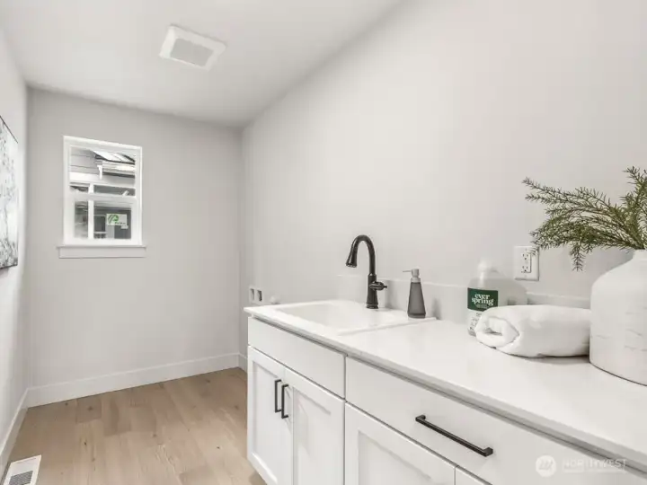 Large laundry room on second story. Interior photos are of the Sheridan model home at Maywood Heights. Same floor plan but colors and finishes will vary. Photos are for illustration purposes only.