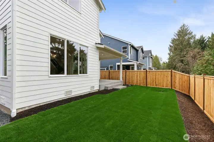 Photos are of backyard on lot 2 at Signature Homes.