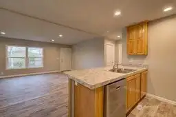 View of kitchen to front door.