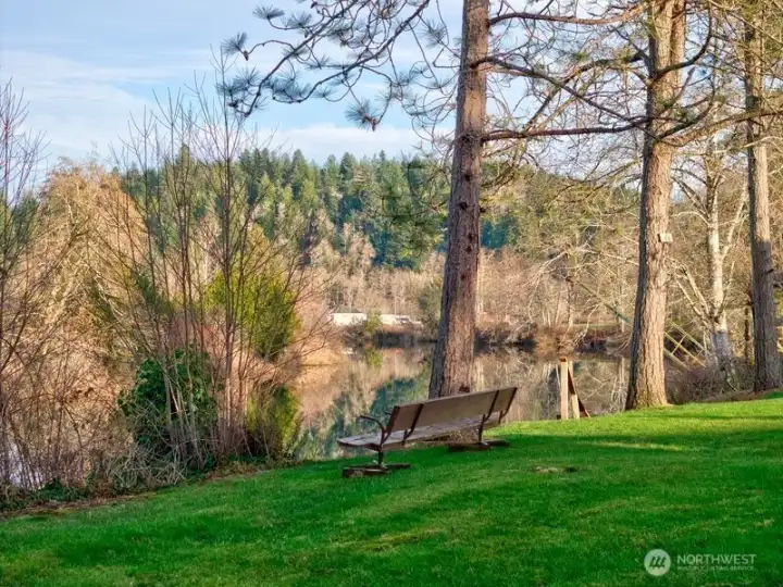 Home has a park-like setting by  te rivers edge