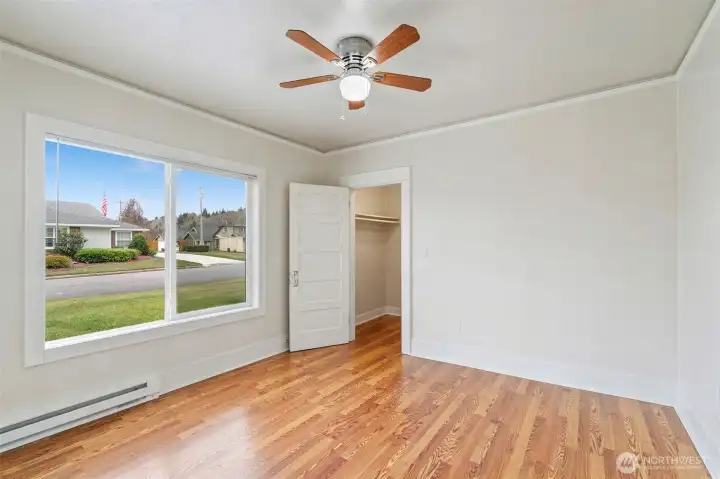 Bedroom 1 w/ walk in closet and new window.