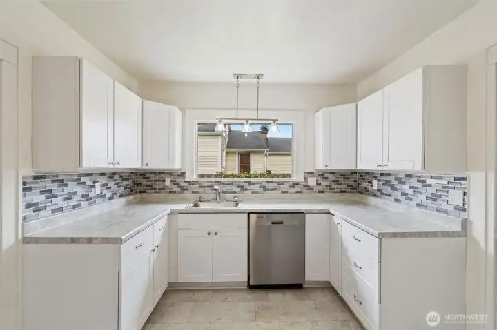 Kitchen window binging in more natural light.