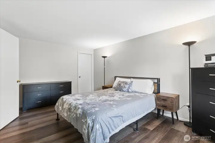 Large primary bedroom feautures a walk-in closet and private updated 3/4 bath.