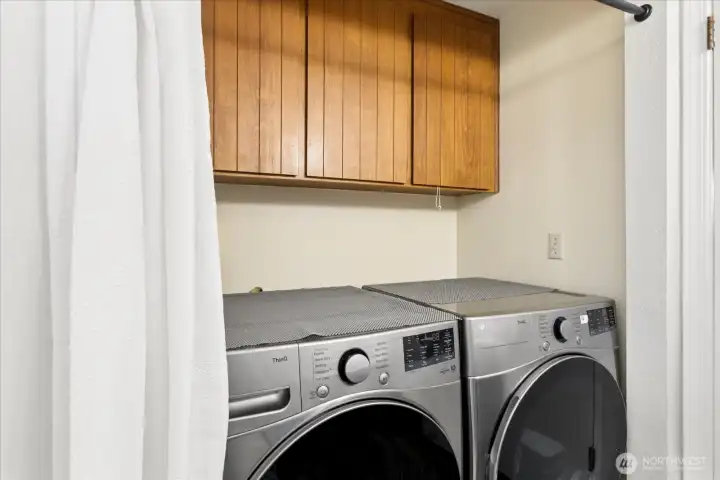 Built in storage above  the washer & dryer.