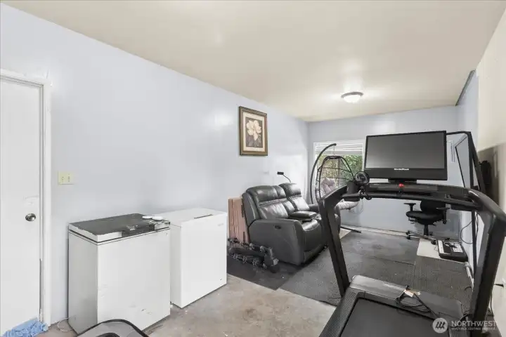 Flex space off of garage. Workout? Storage? Man cave?  You choose!