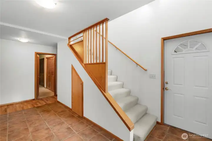 Tile entry, Front door, with storage underneath the stairs