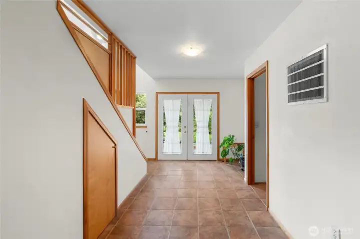 tile entry showing the french doors leading to wrap around deck