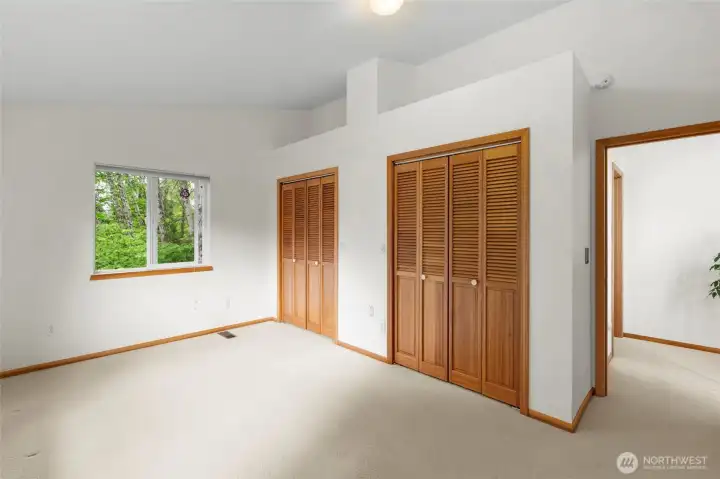 Guest Room #3 with vaulted ceilings & storage loft