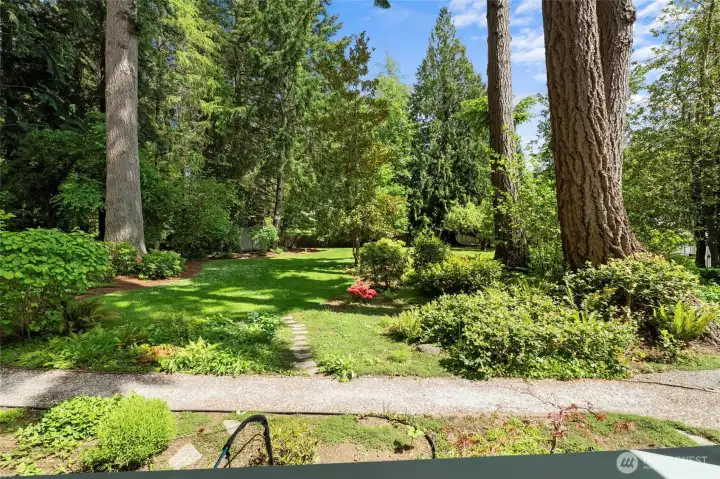 Manicured flower beds and gardens throughout property