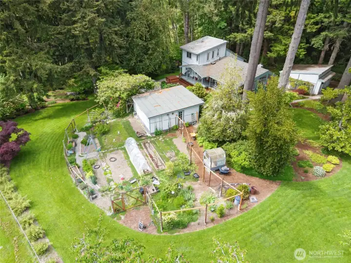 Aerial showing House, detached garage, Shop, & garden