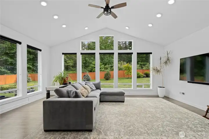 Dramatic living room "wall of glass" fills the home with natural light!