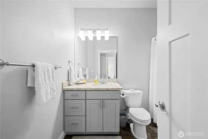 Main floor Guest full bathroom w/ shower & tub.