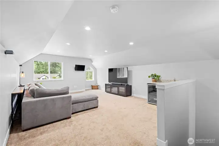 Above the spacious 3-car garage, a Huge bonus room with wet bar!